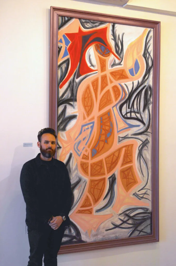 Ian with Painting in Gallery